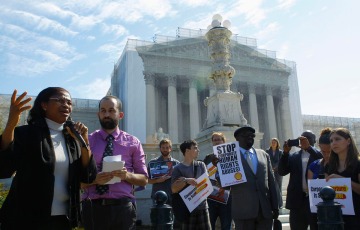 Plaintiff Esther Kiobel joins protest against Royal Dutch Shell Petroleum in front of U.S. Supreme Court in Washington